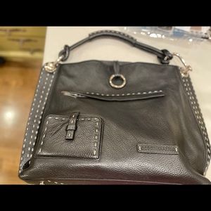 BCBG Black Purse Tote style with white stitching. In perfect condition.